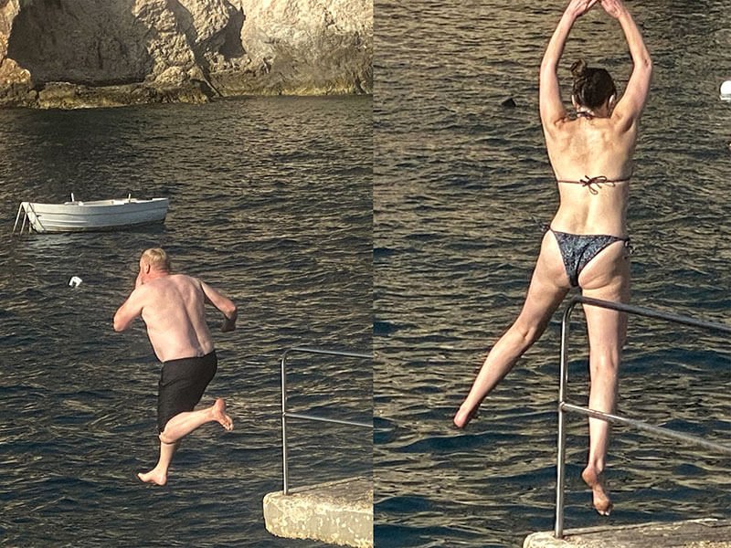 Jumping into the Mediterranean Sea at a pleasant 26 degrees Celsius presents no obstacle at Xlendi Bay during October 2023.
